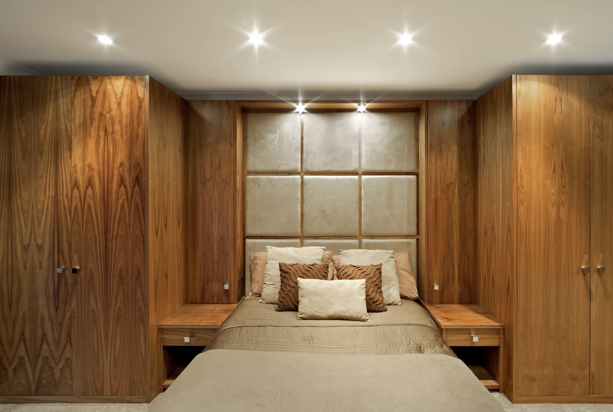 Bespoke fitted bedroom with walnut wardrobes in St Neots Cambridgeshire by Cromwell Interiors